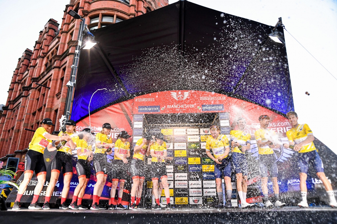 Cyclists celebrating on podium
