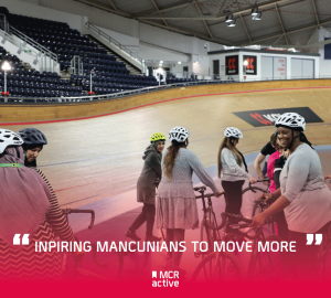 Women on bikes at the Manchester Velodrome with text 'inspiring mancunians to move more'